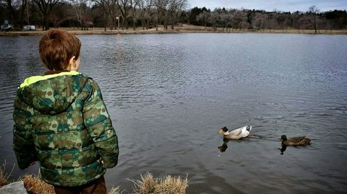 Full length of woman standing in lake