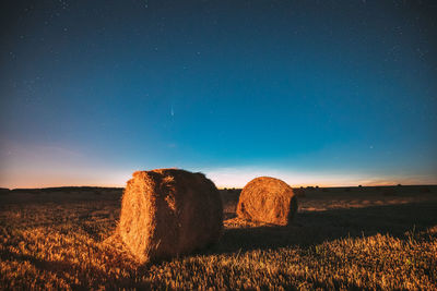 Scenic view of field against sky at night