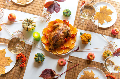 Thanksgiving celebration traditional dinner setting food concept. top view on roasted turkey 