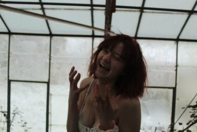 Portrait of young woman lying on floor