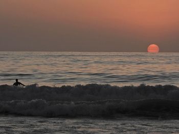 Scenic view of sea against sky during sunset