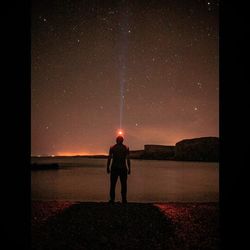 Scenic view of sea against sky at night