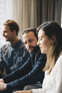 Businessman working with colleagues in office