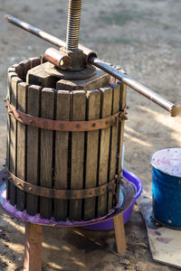 Winepress with red must and helical screw. traditional old technique of wine making.