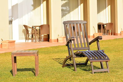 Empty chairs and table in park