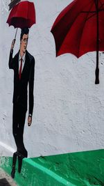 Person holding umbrella