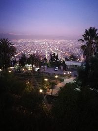 High angle view of illuminated city buildings at night