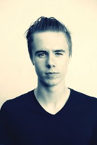 Portrait of young man against white background