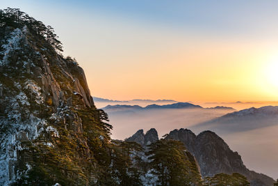 Scenic view of mountain against sky during sunset