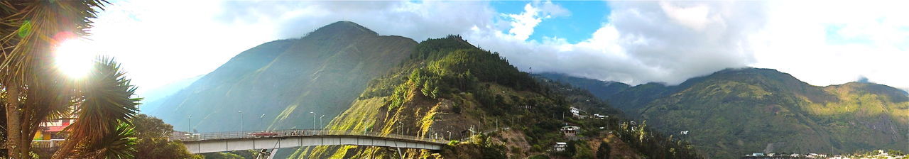 Scenic view of mountains against cloudy sky