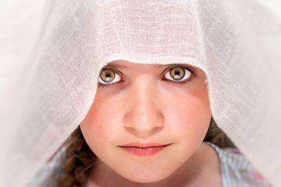 Close-up portrait of woman wearing veil