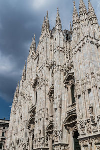 Low angle view of ornate building against sky