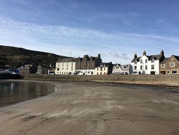 Buildings against cloudy sky