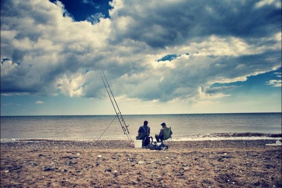 sky, sea, water, men, horizon over water, leisure activity, lifestyles, togetherness, cloud - sky, beach, tranquility, bonding, nature, tranquil scene, person, scenics, beauty in nature, shore