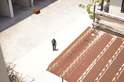 High angle view of people walking on footpath