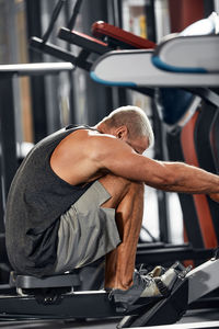 Low section of man exercising in gym