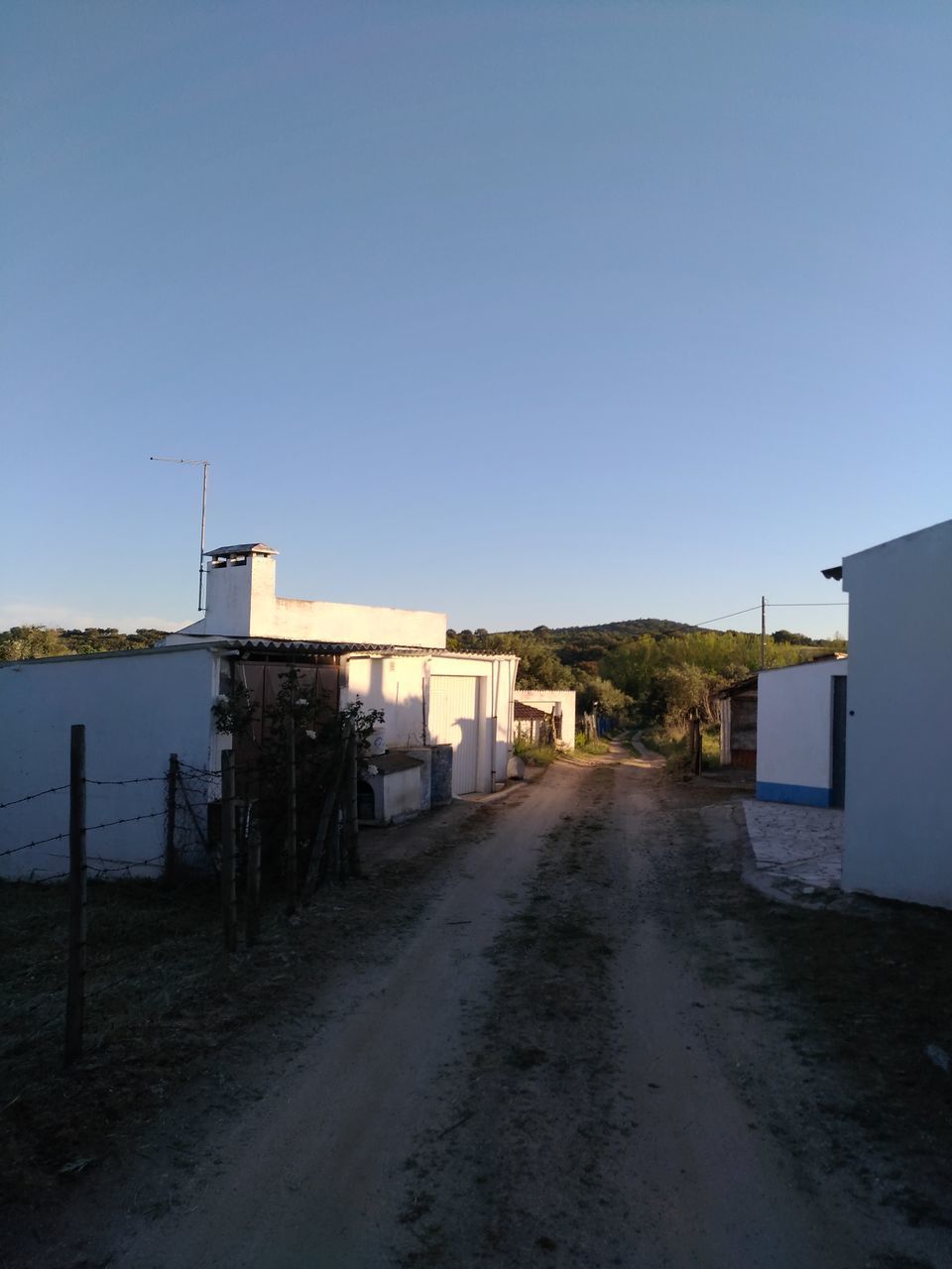 HOUSES AGAINST SKY