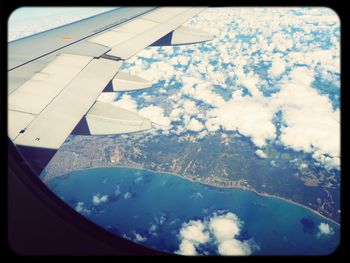 Aerial view of landscape seen through airplane window