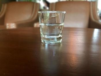 Close-up of empty drinking glass on table