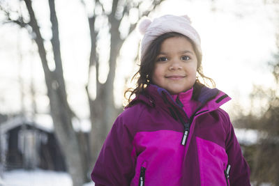 Portrait of smiling girl in snow