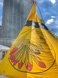 Low angle view of multi colored tent against sky