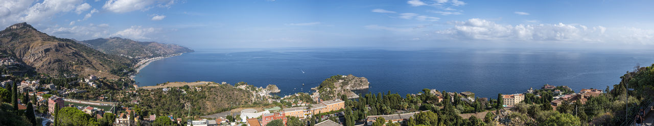 Aerial wide angle view of taormina and its beautiful coastline