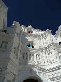 Low angle view of statue against sky