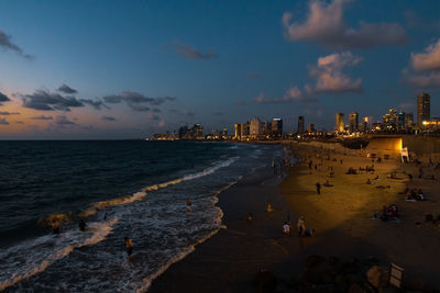 Panoramic view of beach against sky during sunset