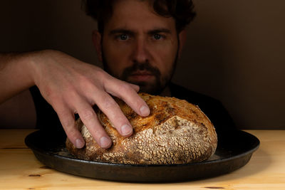 Cropped hand of person preparing food