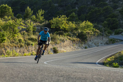 Man riding a bicycle on a costa blanca mountain road