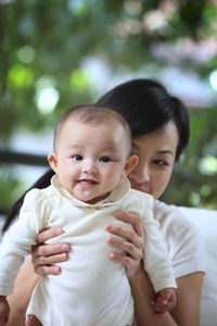 Portrait of cute baby boy outdoors