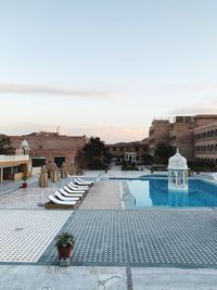 High angle view of swimming pool against buildings in city