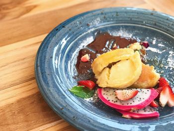 Close-up of leftovers food in plate on table