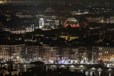 Aerial view of illuminated city at night