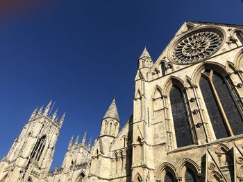 Low angle view of building against blue sky