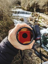 High angle view of man photographing camera