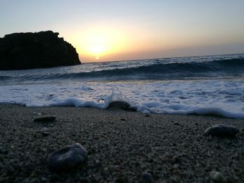 Scenic view of sea against clear sky during sunset