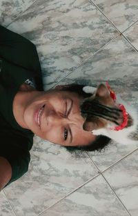 High angle portrait of woman on floor