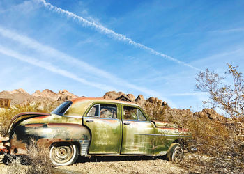 Car on field against sky