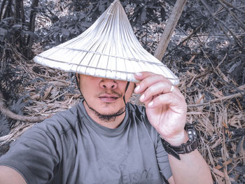 Portrait of young man wearing hat