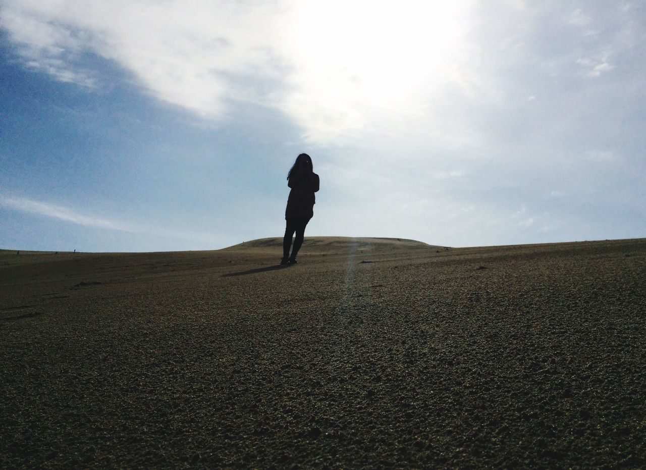 sky, full length, lifestyles, rear view, leisure activity, men, standing, landscape, tranquil scene, tranquility, cloud - sky, walking, silhouette, nature, scenics, person, cloud, casual clothing