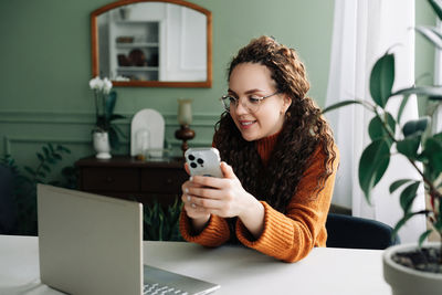 Young woman using mobile phone