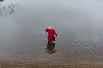 Rear view of girl in lake