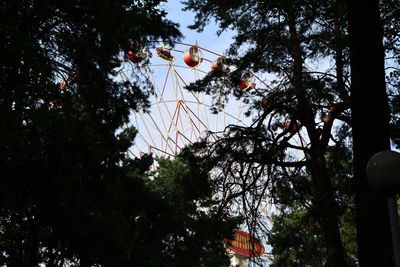 Low angle view of amusement park ride against sky