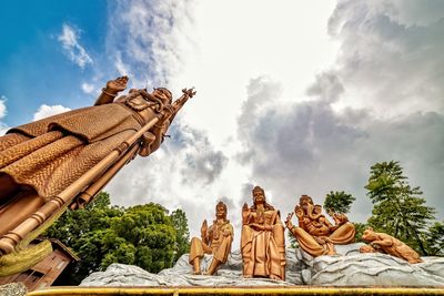 Low angle view of statue against cloudy sky