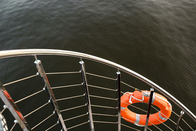 High angle view of railing by sea