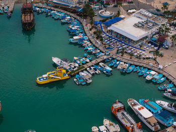 High angle view of boats moored at harbor