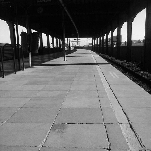 EMPTY ROAD WITH COLUMNS IN FOREGROUND