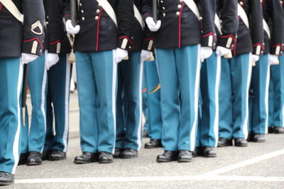 Low section of military standing on street