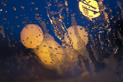 Close-up of water drops on glass